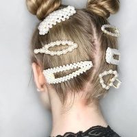 Twisted-space-buns-with-pearl-accessories